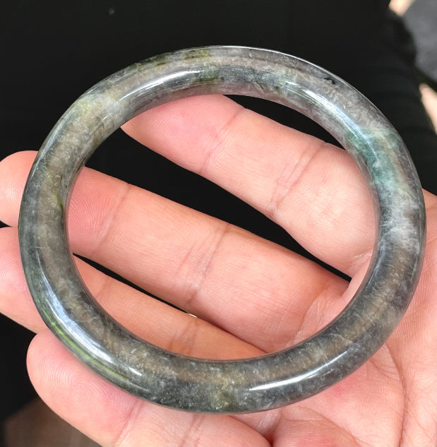 Handcrafted genuine Grade A Burmese jadeite bracelet showcasing a beautiful stormy dark and green appearance
