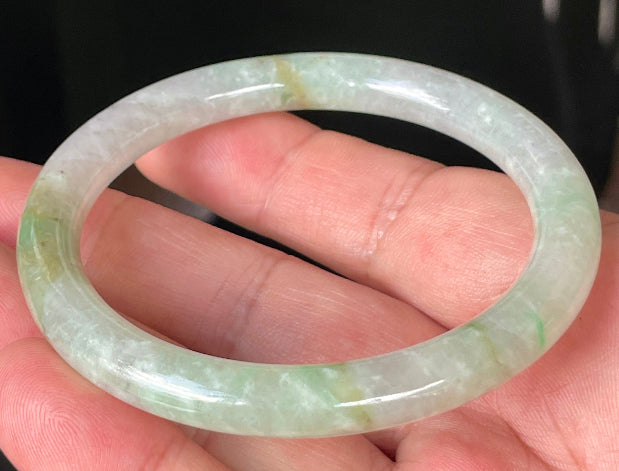 Solid icy clear, milky white, and green natural Type A Burmese jade bangle bracelet in size 58.4mm