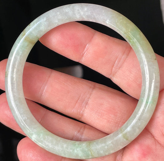 Solid icy clear, milky white, and green natural Type A Burmese jade bangle bracelet in size 58.4mm