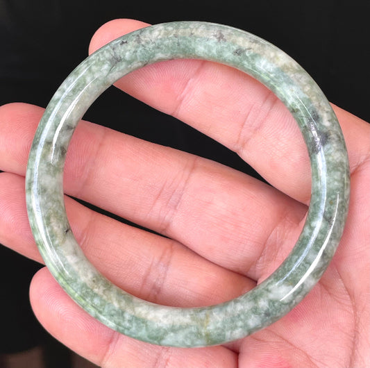 Solid icy imperial green and apple green natural Type A Burmese jade bangle bracelet in size 57mm