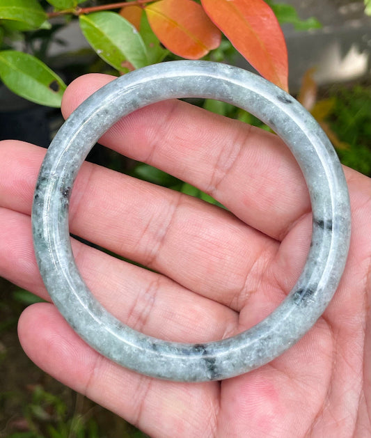 Solid gray and milky white natural Type A Burmese jade bangle bracelet in size 58.6mm