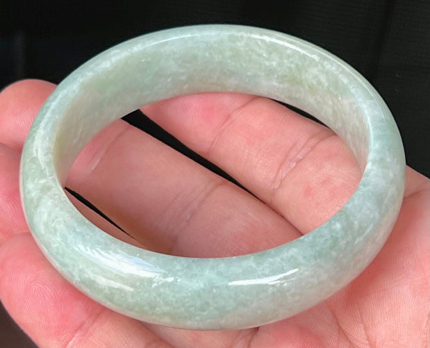 Rounded classic profile of 58.2mm icy light green and milky white Burmese jade bangle JB536