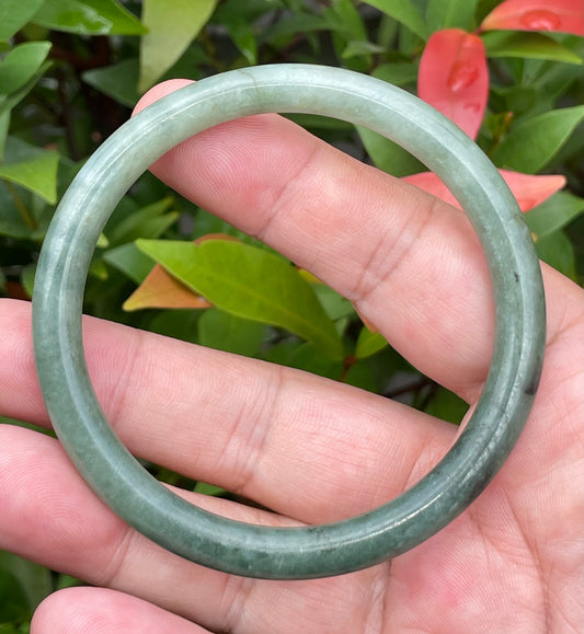Slim profile icy apple green and moss green natural Type A Burmese jade bangle bracelet in size 60.8mm