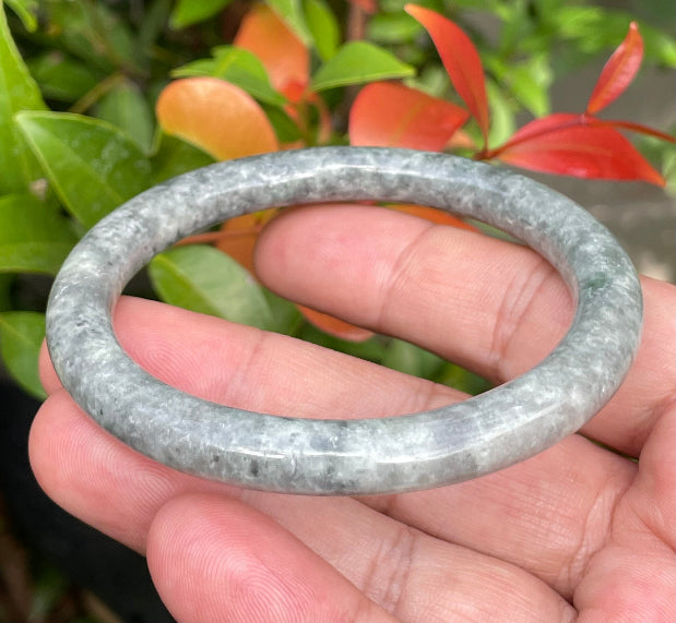 Video showcasing the vitreous luster and beautiful icy grayish black and milky white hues of the 59.2mm Burmese jade bangle JB945