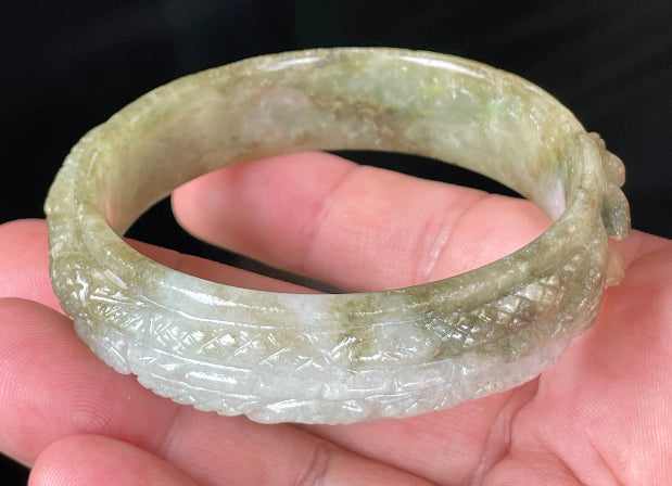 Glassy luster and translucent texture of the authentic Myanmar jade hand-carved bangle JB208