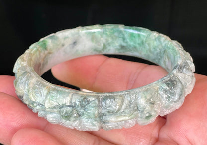 Glassy luster and translucent texture of the authentic Myanmar jade hand-carved bangle JB443