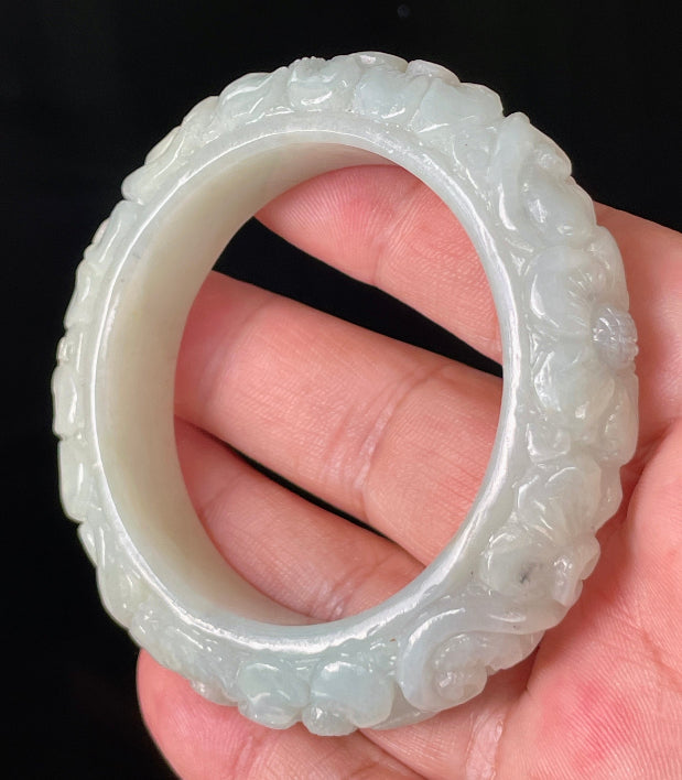 Vitreous luster and semi-translucent texture of the authentic Myanmar jade hand-carved bangle JB810