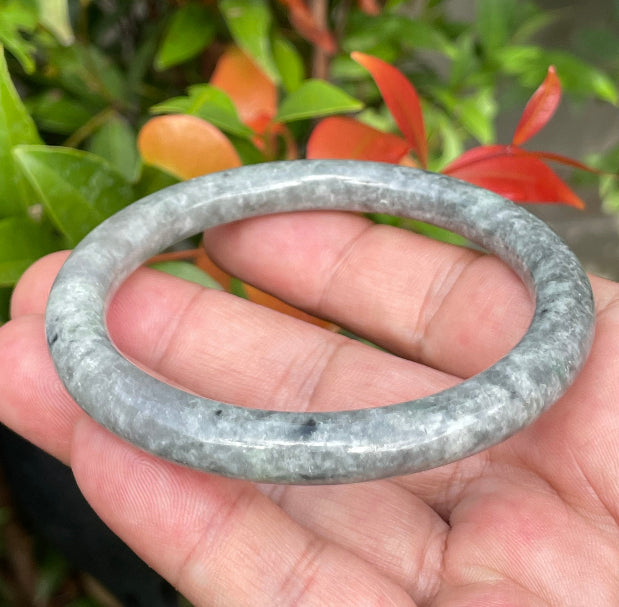 Video showcasing the vitreous luster and beautiful icy grayish black and milky white hues of the 59.2mm Burmese jade bangle JB945