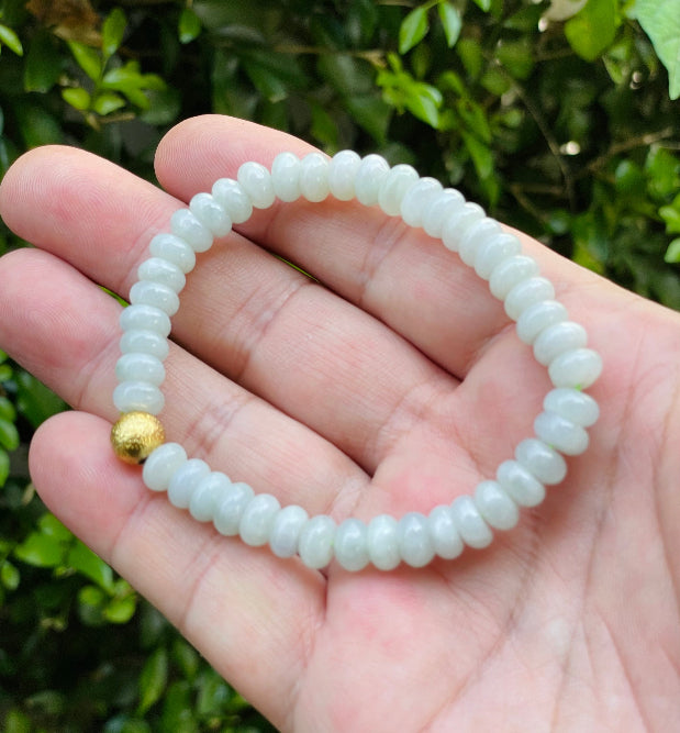 Vitreous luster and fine texture of the authentic Myanmar jade bead bracelet JBB169 with a gold-tone accent
