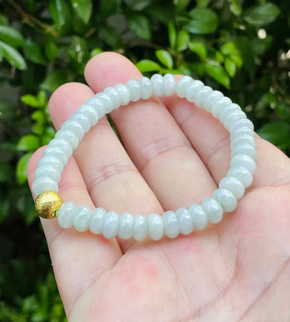 Vitreous luster and fine texture of the authentic Myanmar jade bead bracelet JBB169 with a gold-tone accent