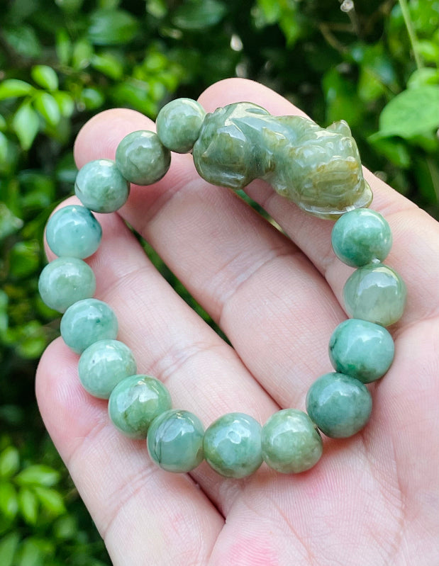 Vitreous luster and fine texture of the authentic Myanmar jade bead bracelet JBB164 with a wealth and protection Pixiu charm