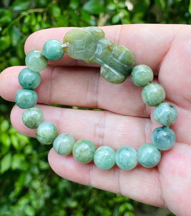 Vitreous luster and fine texture of the authentic Myanmar jade bead bracelet JBB164 with a wealth and protection Pixiu charm