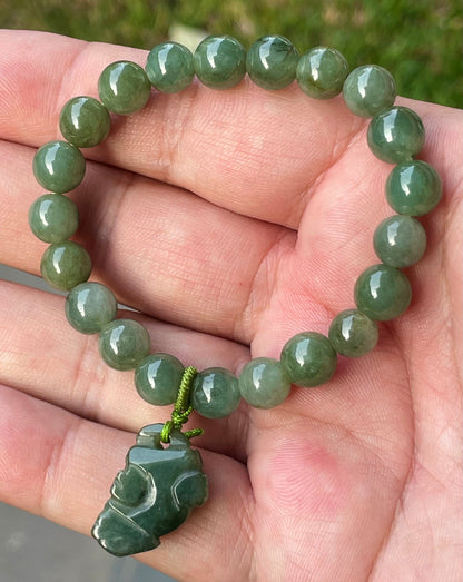 Vitreous luster and fine texture of the authentic Myanmar jade bead bracelet JBB181 with a wealth and protection Pixiu charm