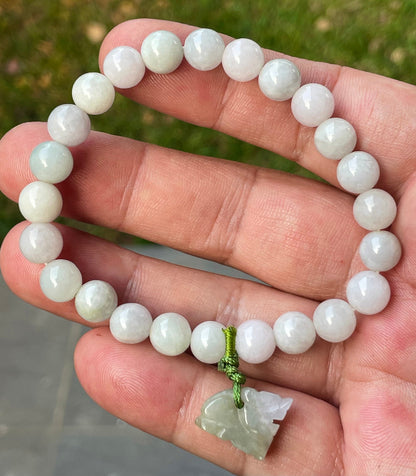 Vitreous luster and fine texture of the authentic Myanmar jade bead bracelet JBB184 with a wealth and protection tiger charm