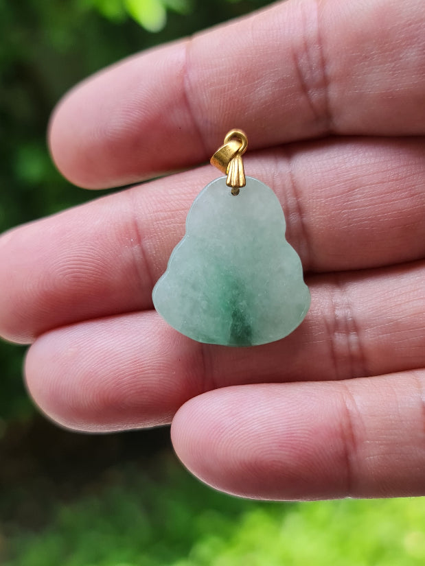 Untreated Type A Burmese jade pendant showing soft luster with a peaceful icy imperial green tone