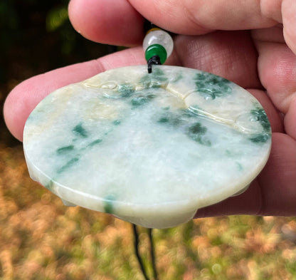 Vitreous luster and fine texture of the authentic Myanmar jade pendant JP082 showcasing a carved dragon Feng Shui design for strength and protection