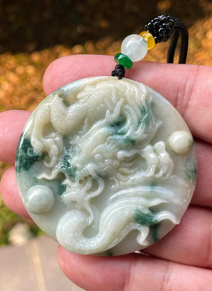 Vitreous luster and fine texture of the authentic Myanmar jade pendant JP082 showcasing a carved dragon Feng Shui design for strength and protection