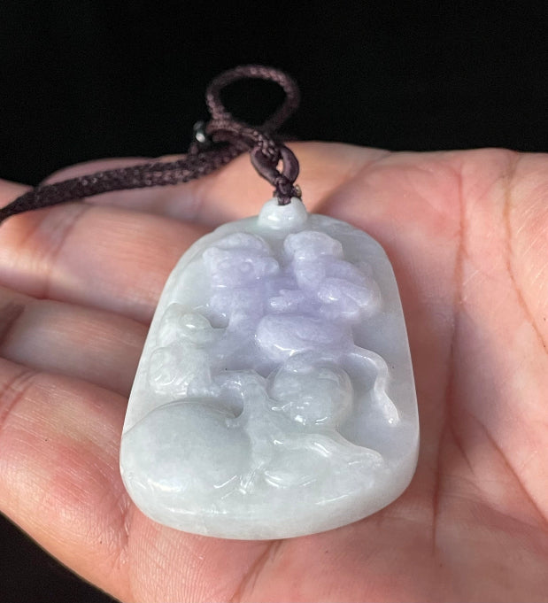 Vitreous luster and fine texture of the authentic Myanmar jade pendant JP021 showcasing a carved double monkey Feng Shui design for joy and companionship