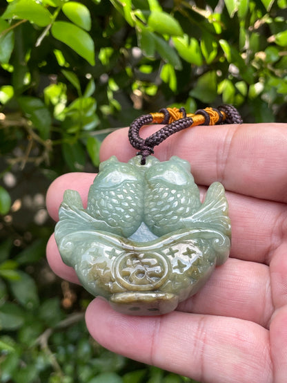 Vitreous luster and fine texture of the authentic Myanmar jade pendant JP037 showcasing a carved twin fish Feng Shui design for abundance and prosperity