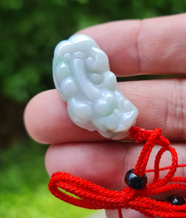 Vitreous luster and fine texture of the authentic Myanmar jade pendant JP100 showcasing a carved Pixiu Feng Shui design for wealth and protection