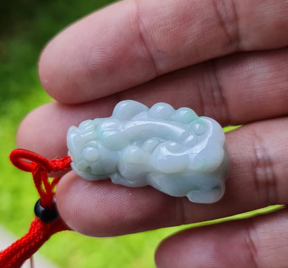 Vitreous luster and fine texture of the authentic Myanmar jade pendant JP100 showcasing a carved Pixiu Feng Shui design for wealth and protection