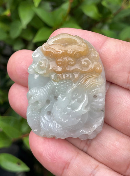 Untreated Type A Burmese jade pendant showing a smooth polished finish with an intricate Dragon carving