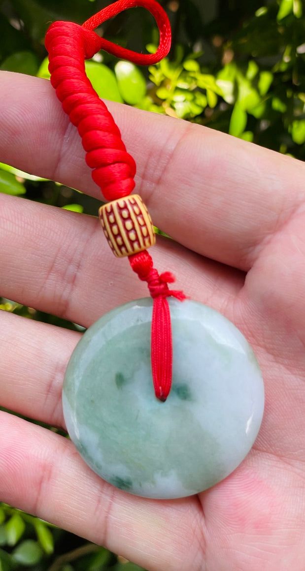 Smooth texture of the authentic Myanmar jade pendant JP061 showcasing a classic round bi disc Feng Shui design for harmony and balance