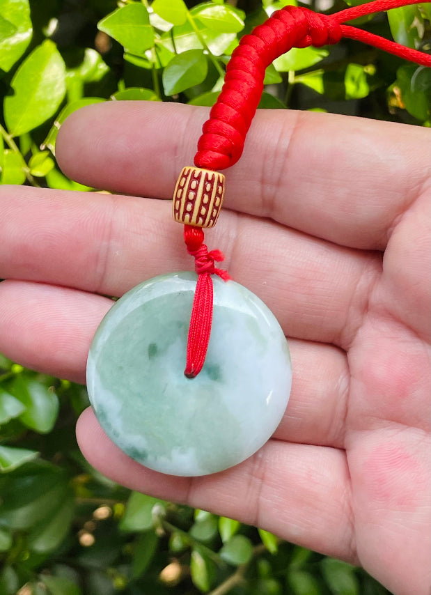 Smooth texture of the authentic Myanmar jade pendant JP061 showcasing a classic round bi disc Feng Shui design for harmony and balance
