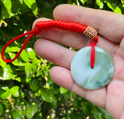 Smooth texture of the authentic Myanmar jade pendant JP061 showcasing a classic round bi disc Feng Shui design for harmony and balance