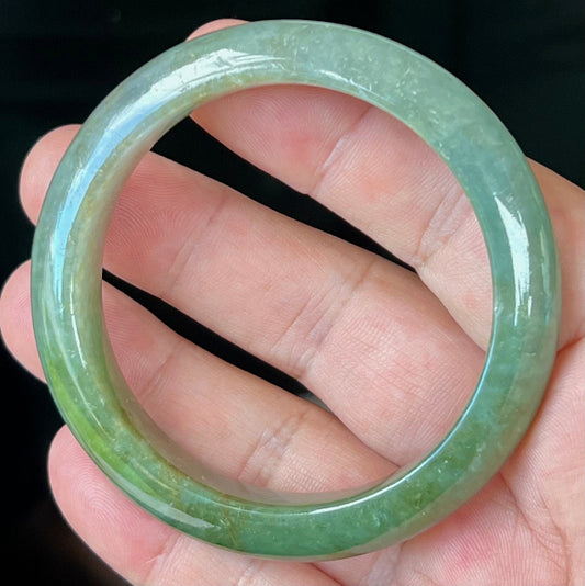 Rounded classic profile of 56mm icy green Burmese jade bangle JB549