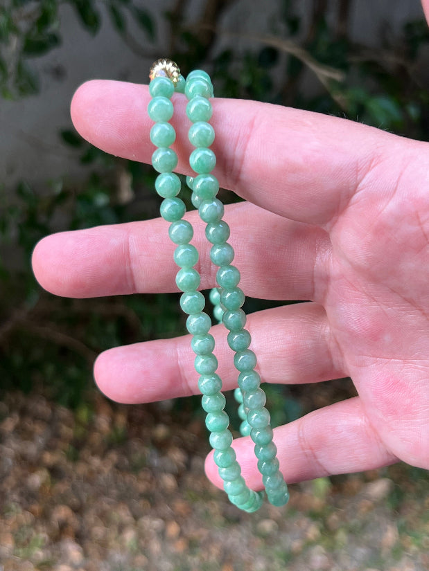 Continuous circle of perfectly round icy imperial and apple green genuine Grade A Burmese jadeite beads