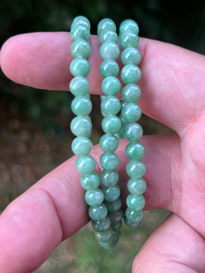 Continuous circle of perfectly round icy imperial and apple green genuine Grade A Burmese jadeite beads