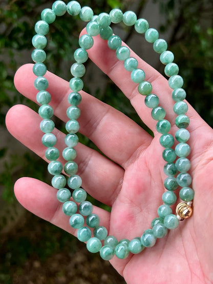Continuous circle of perfectly round icy white and green genuine Grade A Burmese jadeite beads