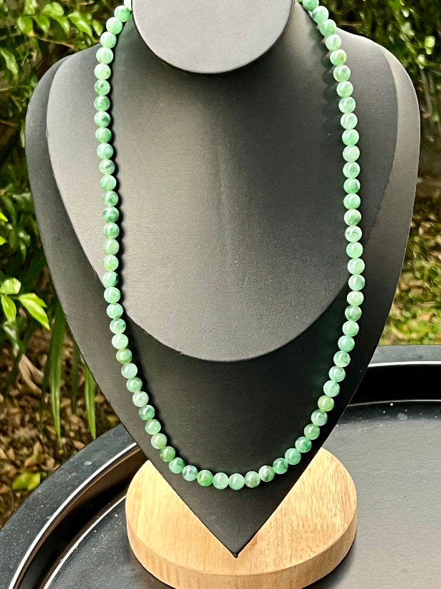 Continuous circle of perfectly round icy white and green genuine Grade A Burmese jadeite beads