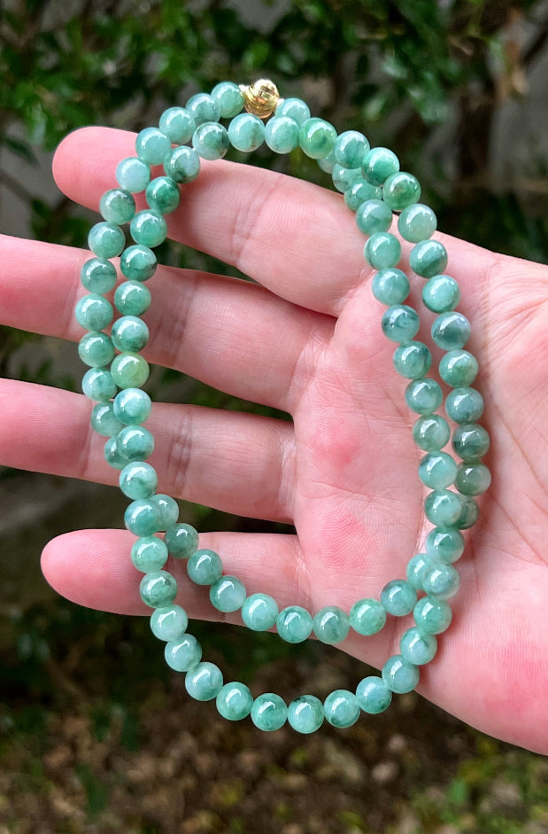 Continuous circle of perfectly round icy white and green genuine Grade A Burmese jadeite beads