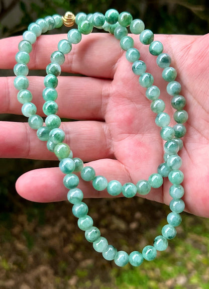 Continuous circle of perfectly round icy white and green genuine Grade A Burmese jadeite beads