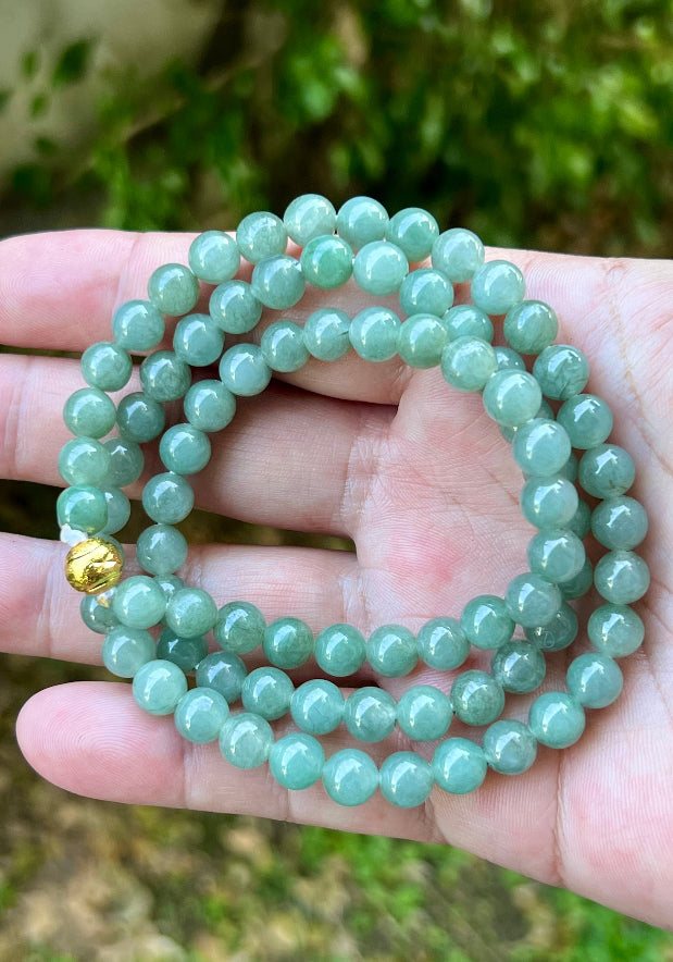 Continuous circle of perfectly round icy imperial white and apple green genuine Grade A Burmese jadeite beads
