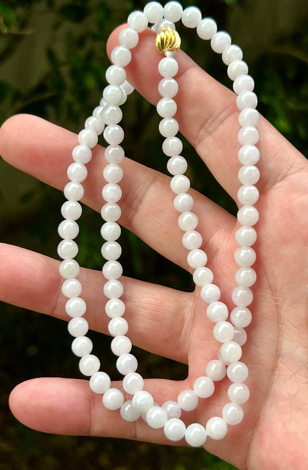 Continuous circle of perfectly round icy white and light green genuine Grade A Burmese jadeite beads