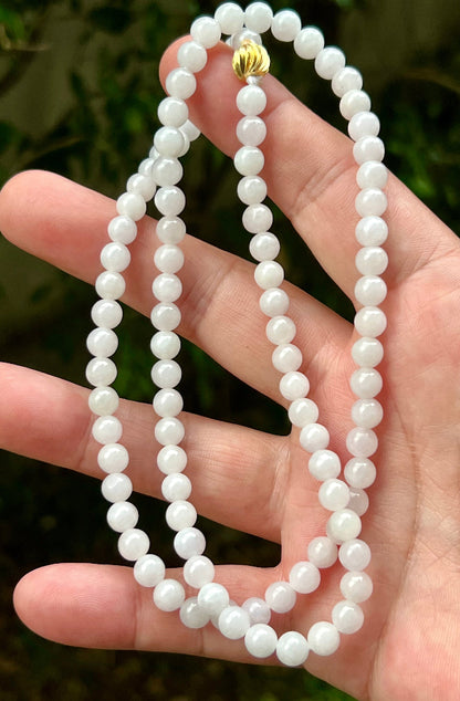 Continuous circle of perfectly round icy white and light green genuine Grade A Burmese jadeite beads