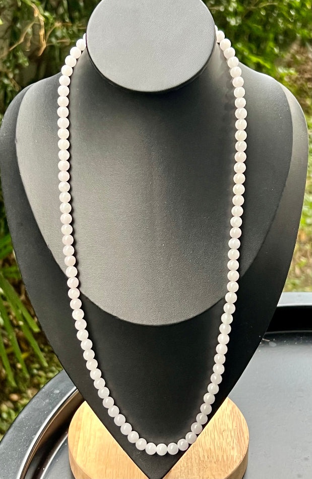 Continuous circle of perfectly round icy white and light green genuine Grade A Burmese jadeite beads
