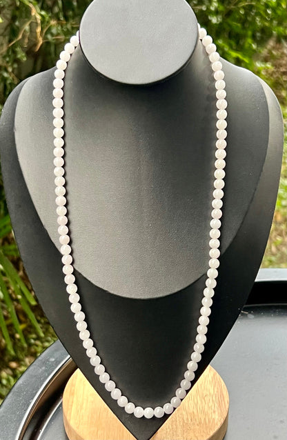 Continuous circle of perfectly round icy white and light green genuine Grade A Burmese jadeite beads