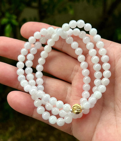 Continuous circle of perfectly round icy white and light green genuine Grade A Burmese jadeite beads