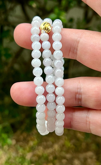 Continuous circle of perfectly round icy white and light green genuine Grade A Burmese jadeite beads