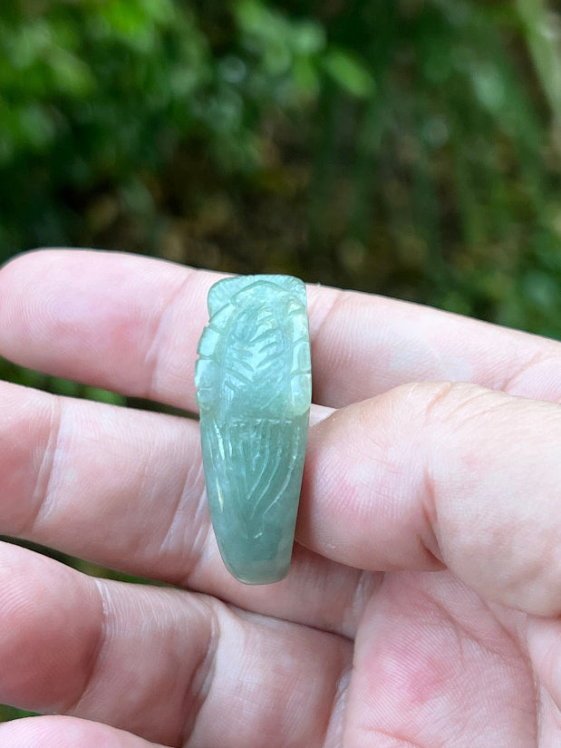 Vitreous luster and cool luminous glow of hand-sculpted certified Grade A Myanmar jadeite jewelry