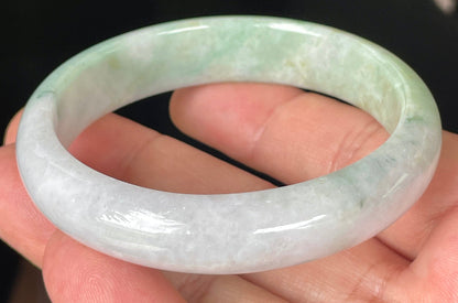 Rounded classic profile of 57mm icy lavender, milky white and green Burmese jade bangle JB356
