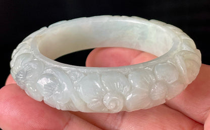 Handcrafted genuine Grade A Burmese jadeite bracelet showcasing a beautiful green floral appearance and certification