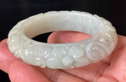 Handcrafted genuine Grade A Burmese jadeite bracelet showcasing a beautiful green floral appearance and certification