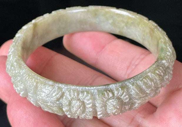 Handcrafted genuine Grade A Burmese jadeite bracelet showcasing a beautiful green and white floral appearance and certification
