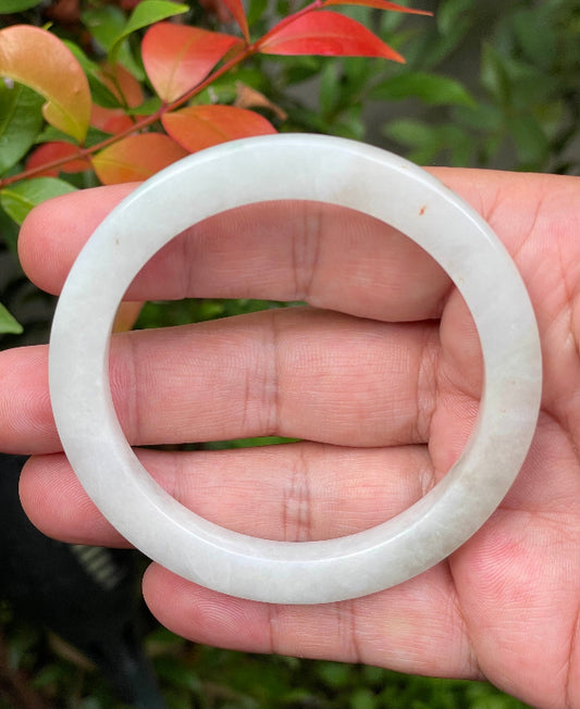 Solid icy milky white natural Type A Burmese jade bangle bracelet in flat inner style, size 58.2mm