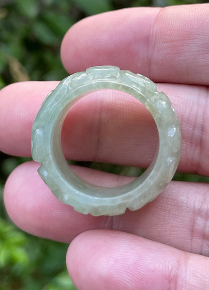 Glassy vitreous luster and semi-translucent texture of hand-sculpted Grade A Myanmar jadeite jewelry